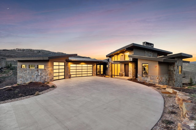 4014 Aspen Camp Loop, Park City, UT 84098 - prairie-style house featuring driveway, a garage, and stone siding