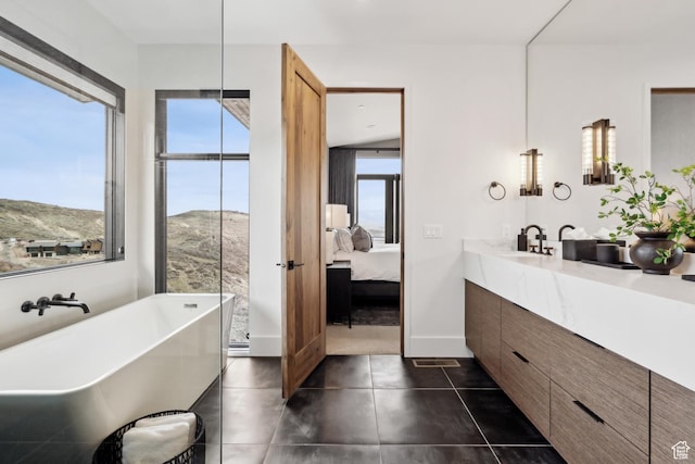 4014 Aspen Camp Loop, Park City, UT 84098 - ensuite bathroom with tile patterned flooring, a freestanding tub, vanity, and ensuite bath