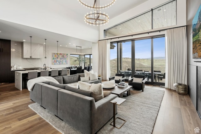 4014 Aspen Camp Loop, Park City, UT 84098 - living area with light wood finished floors, a mountain view, recessed lighting, and a notable chandelier