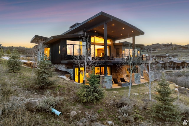 4014 Aspen Camp Loop, Park City, UT 84098 - back of property featuring a patio, a balcony, and stone siding