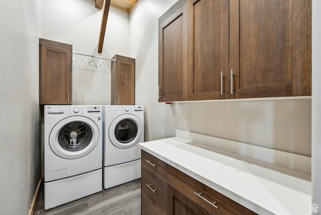 46997 W Thunder Ridge Rd, Fruitland, UT 84027 - laundry area featuring light wood-type flooring, washer and clothes dryer, and cabinet space