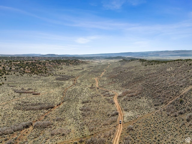 46997 W Thunder Ridge Rd, Fruitland, UT 84027 - aerial view featuring view of desert, a mountain view, and a rural view