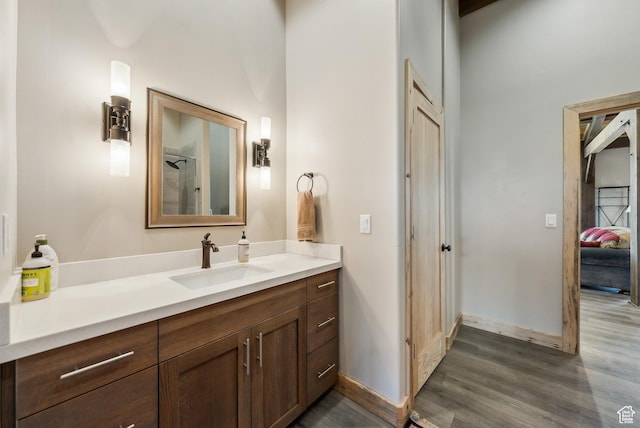 46997 W Thunder Ridge Rd, Fruitland, UT 84027 - bathroom featuring vanity, wood finished floors, and baseboards
