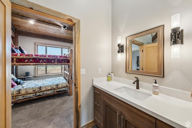 46997 W Thunder Ridge Rd, Fruitland, UT 84027 - ensuite bathroom featuring wood ceiling, vanity, and ensuite bath