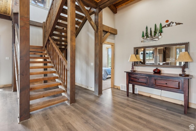 46997 W Thunder Ridge Rd, Fruitland, UT 84027 - stairway with baseboards, visible vents, wood finished floors, and a towering ceiling