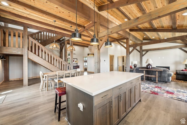 46997 W Thunder Ridge Rd, Fruitland, UT 84027 - kitchen with light countertops, wooden ceiling, a center island, open floor plan, and light wood finished floors
