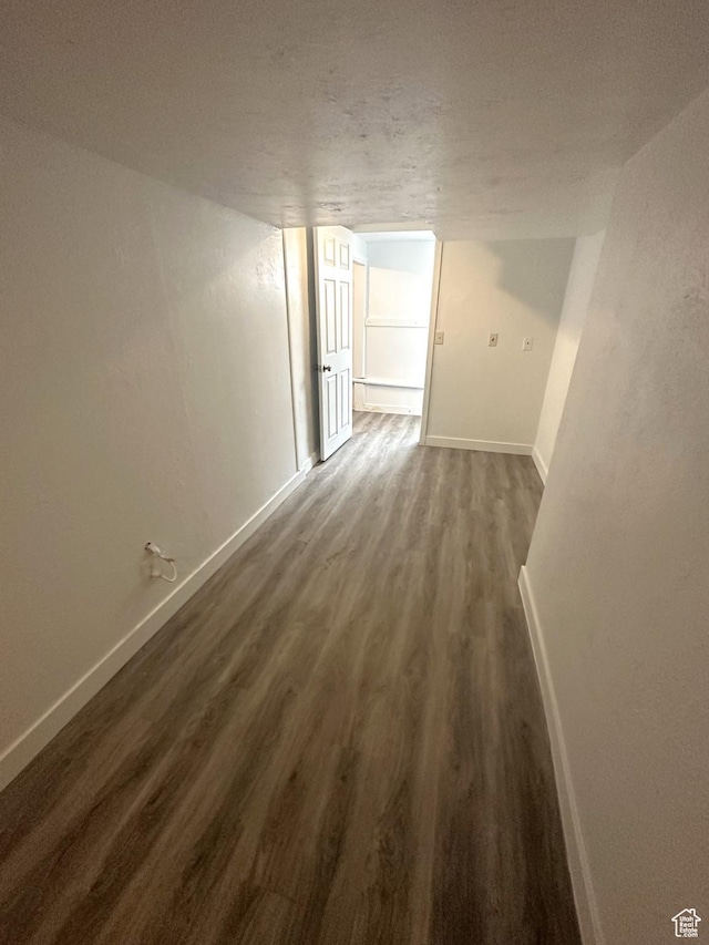983 29th St, Ogden, UT 84403 - corridor with dark wood-type flooring and baseboards