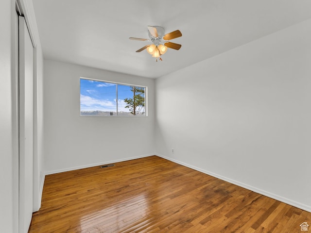 8323 S Adams St, Midvale, UT 84047 - empty room featuring a ceiling fan, wood finished floors, and baseboards