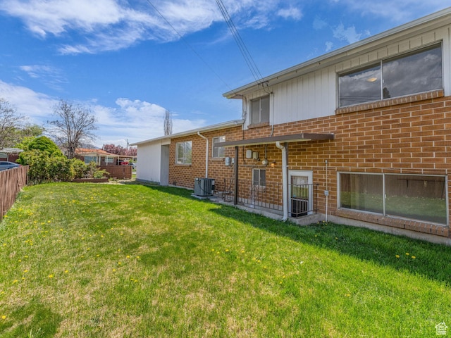 8323 S Adams St, Midvale, UT 84047 - back of property featuring cooling unit and brick siding