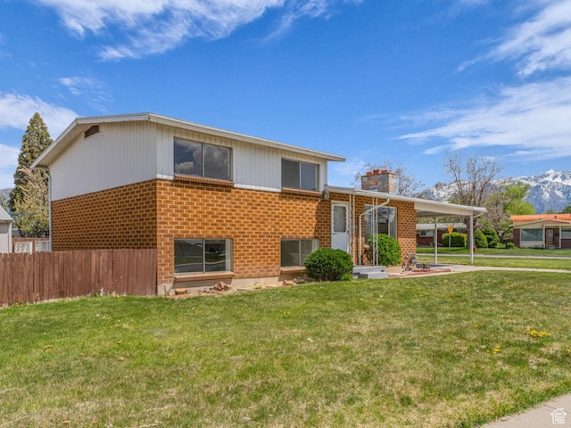 8323 S Adams St, Midvale, UT 84047 - split level home with brick siding and a chimney