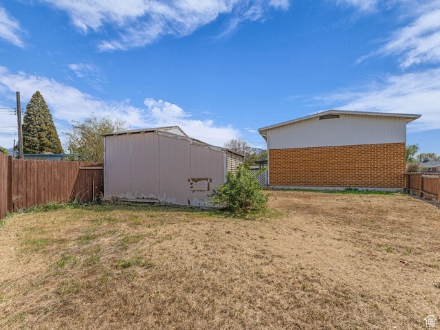 8323 S Adams St, Midvale, UT 84047 - view of yard with an outdoor structure and a storage unit