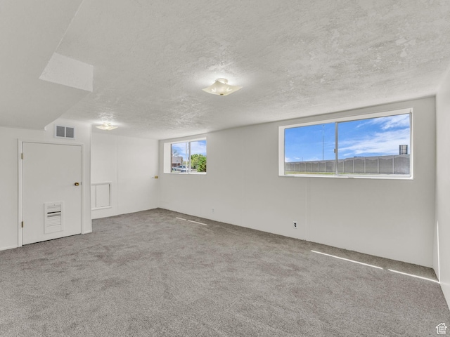 8323 S Adams St, Midvale, UT 84047 - unfurnished room with a textured ceiling and carpet floors