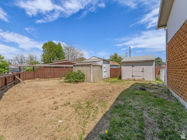 8323 S Adams St, Midvale, UT 84047 - view of yard featuring a shed and an outdoor structure