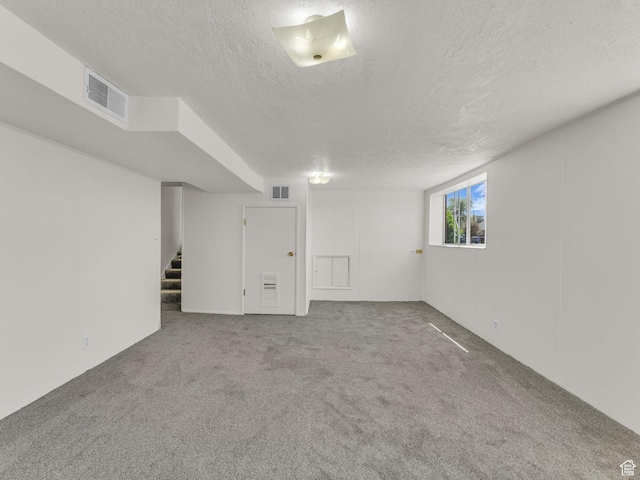 8323 S Adams St, Midvale, UT 84047 - basement with a textured ceiling, carpet flooring, and stairs
