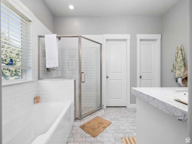 full bath featuring a garden tub, recessed lighting, and a stall shower