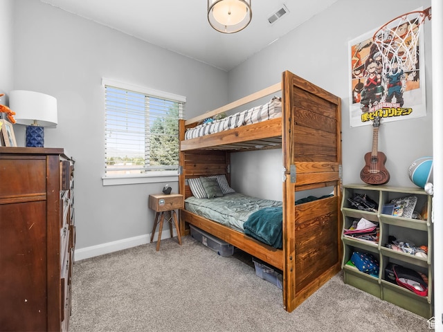 bedroom featuring baseboards, visible vents, and carpet flooring