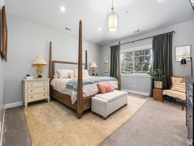 bedroom with light colored carpet, visible vents, and baseboards