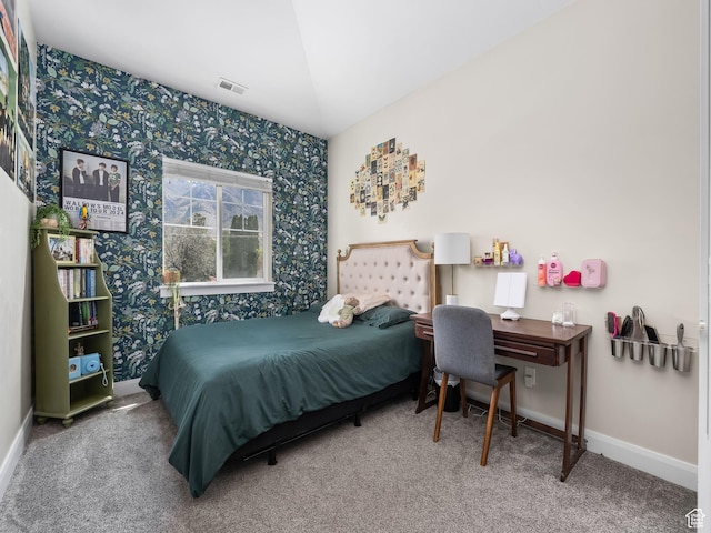 carpeted bedroom featuring visible vents, wallpapered walls, and baseboards