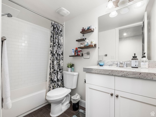full bath with toilet, wood finished floors, shower / bath combo with shower curtain, and vanity