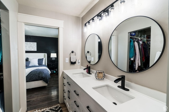 2783 S 1100 W, Nibley, UT 84321 - full bath featuring wood finished floors, ensuite bath, double vanity, and a sink