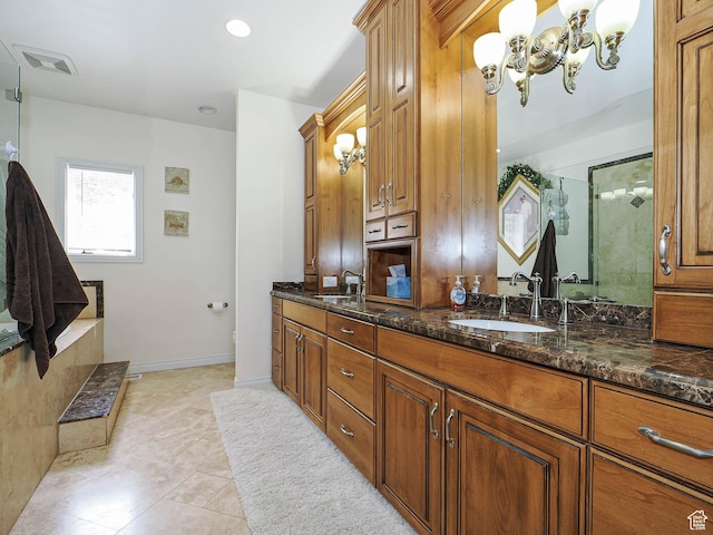 full bathroom with a sink, an inviting chandelier, double vanity, visible vents, and a shower with door