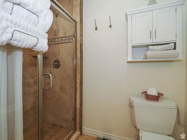 full bathroom with toilet and a shower stall