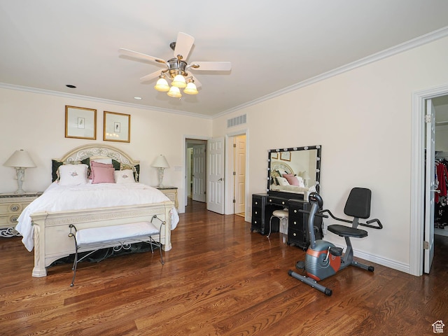 bedroom featuring wood finished floors, ornamental molding, baseboards, visible vents, and a ceiling fan