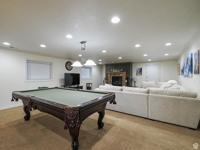 playroom with crown molding, a glass covered fireplace, recessed lighting, light carpet, and pool table