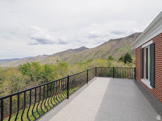 exterior space featuring a mountain view and a balcony
