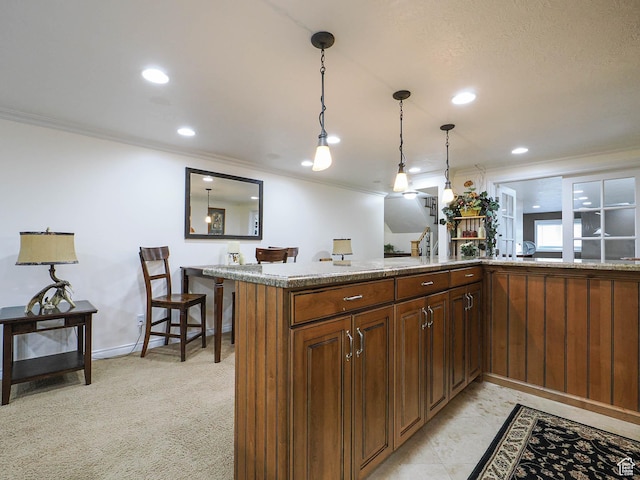 kitchen with pendant lighting, recessed lighting, ornamental molding, and baseboards