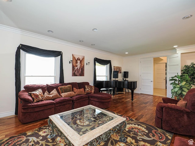 living room with ornamental molding, wood finished floors, and baseboards