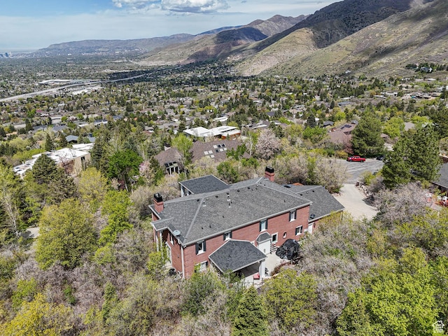 birds eye view of property with a mountain view