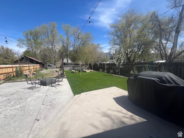 240 S 100 E, Logan, UT 84321 - view of yard with a fenced backyard, a patio area, and an outdoor fire pit