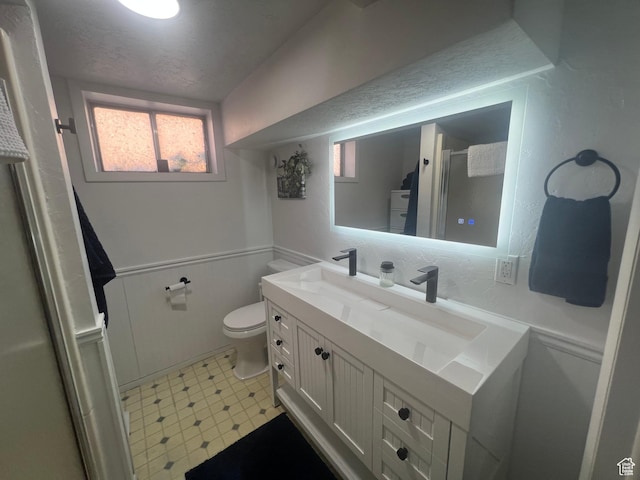 240 S 100 E, Logan, UT 84321 - bathroom with vanity, an enclosed shower, tile patterned floors, and toilet