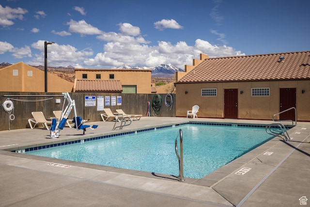 3686 S Spanish Valley Dr Unit W-4, Moab, UT 84532 - pool with a patio, a mountain view, and fence