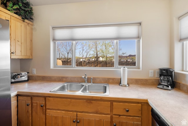 3686 S Spanish Valley Dr Unit W-4, Moab, UT 84532 - kitchen with light countertops, stainless steel fridge, a sink, and a wealth of natural light