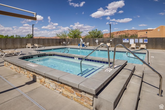 3686 S Spanish Valley Dr Unit W-4, Moab, UT 84532 - pool featuring fence, a patio, and a hot tub