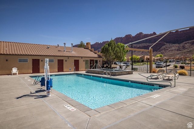 3686 S Spanish Valley Dr Unit W-4, Moab, UT 84532 - pool featuring a patio, fence, and a mountain view