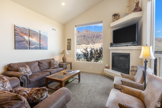 3686 S Spanish Valley Dr Unit W-4, Moab, UT 84532 - living area with carpet flooring, a glass covered fireplace, a wealth of natural light, and visible vents