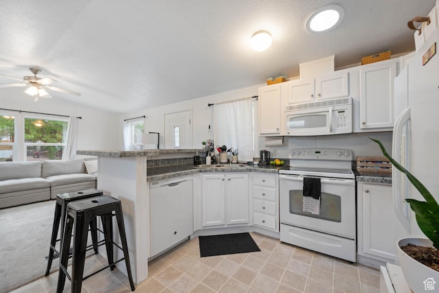 54 Cottonwood Ln, Hurricane, UT 84737 - kitchen with a sink, white cabinetry, a peninsula, white appliances, and open floor plan