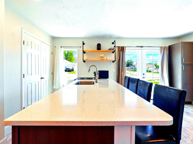 302 34th St, Ogden, UT 84401 - kitchen featuring a sink, french doors, light stone countertops, and open shelves