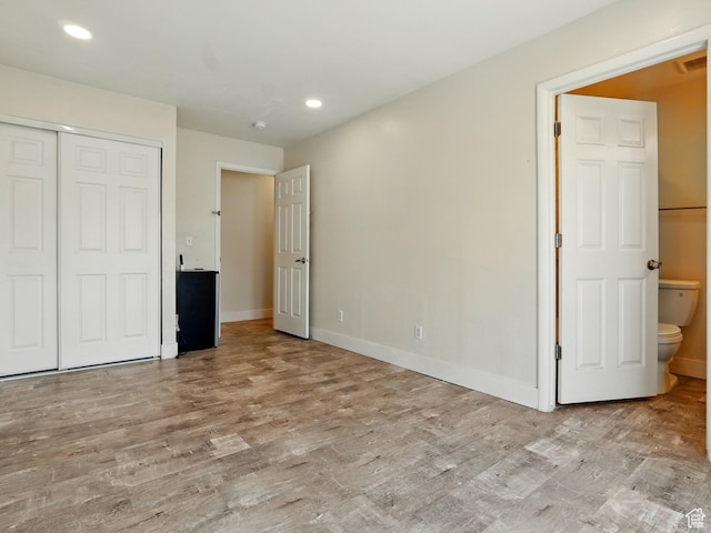 302 34th St, Ogden, UT 84401 - unfurnished bedroom with wood finished floors, baseboards, recessed lighting, and a closet