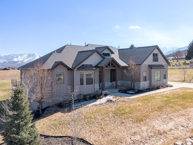 641 W 500 S, Midway, UT 84049 - view of front of home with board and batten siding, a shingled roof, a mountain view, and a front yard