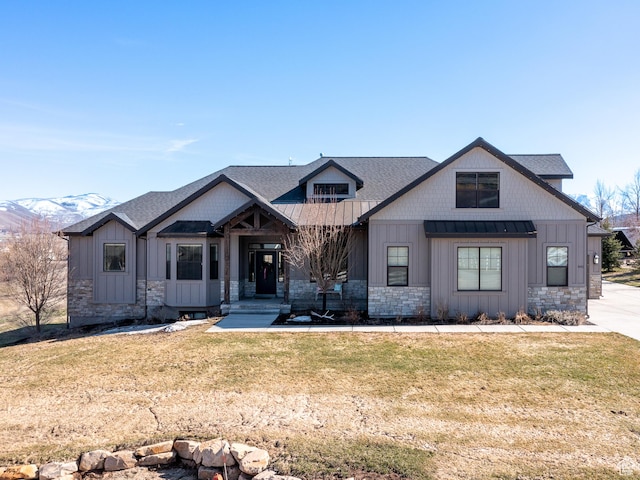 641 W 500 S, Midway, UT 84049 - view of front of home featuring board and batten siding, stone siding, a standing seam roof, and a front lawn