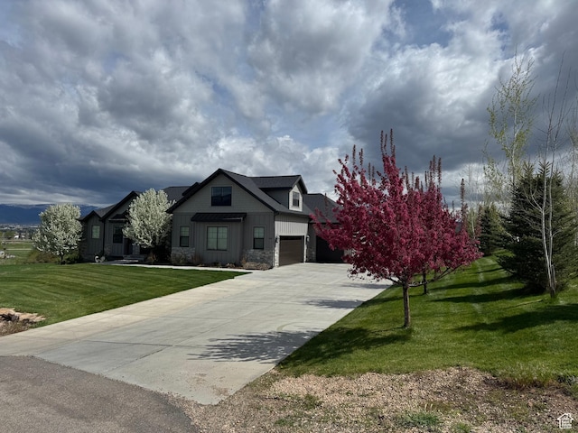 641 W 500 S, Midway, UT 84049 - view of front facade with concrete driveway, a front lawn, stone siding, and board and batten siding