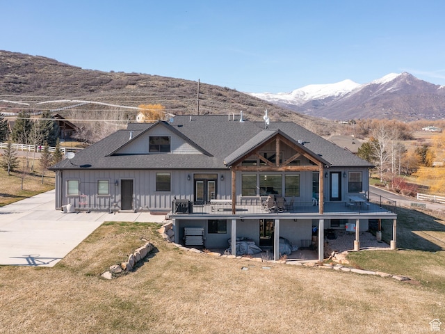 641 W 500 S, Midway, UT 84049 - back of house featuring board and batten siding, a lawn, a shingled roof, and a deck with mountain view