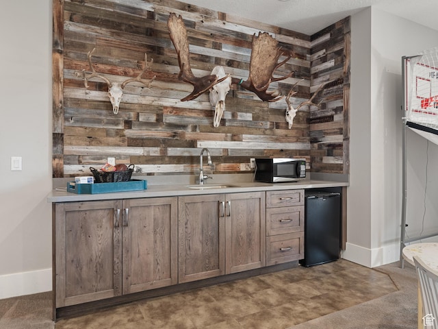 641 W 500 S, Midway, UT 84049 - indoor wet bar with stainless steel microwave, wood walls, and baseboards