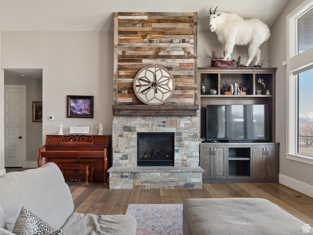 641 W 500 S, Midway, UT 84049 - living area featuring wood finished floors, healthy amount of natural light, baseboards, and a stone fireplace