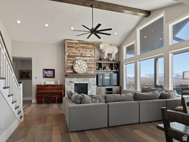 641 W 500 S, Midway, UT 84049 - living room featuring high vaulted ceiling, ceiling fan, wood-type flooring, a stone fireplace, and beamed ceiling