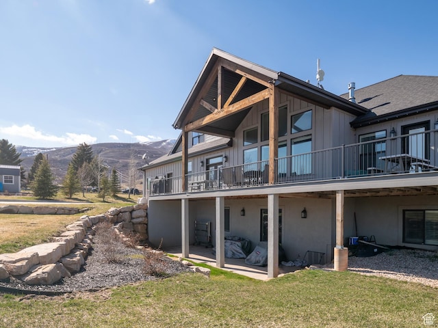 641 W 500 S, Midway, UT 84049 - back of house with a mountain view, a lawn, a patio area, and board and batten siding